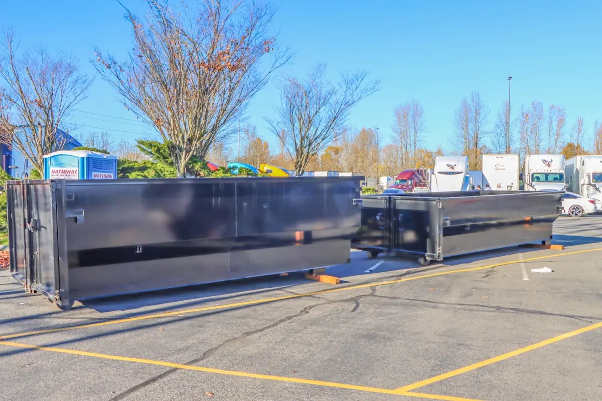 Professional dumpster rental service with roll-off container on residential driveway in Wawarsing